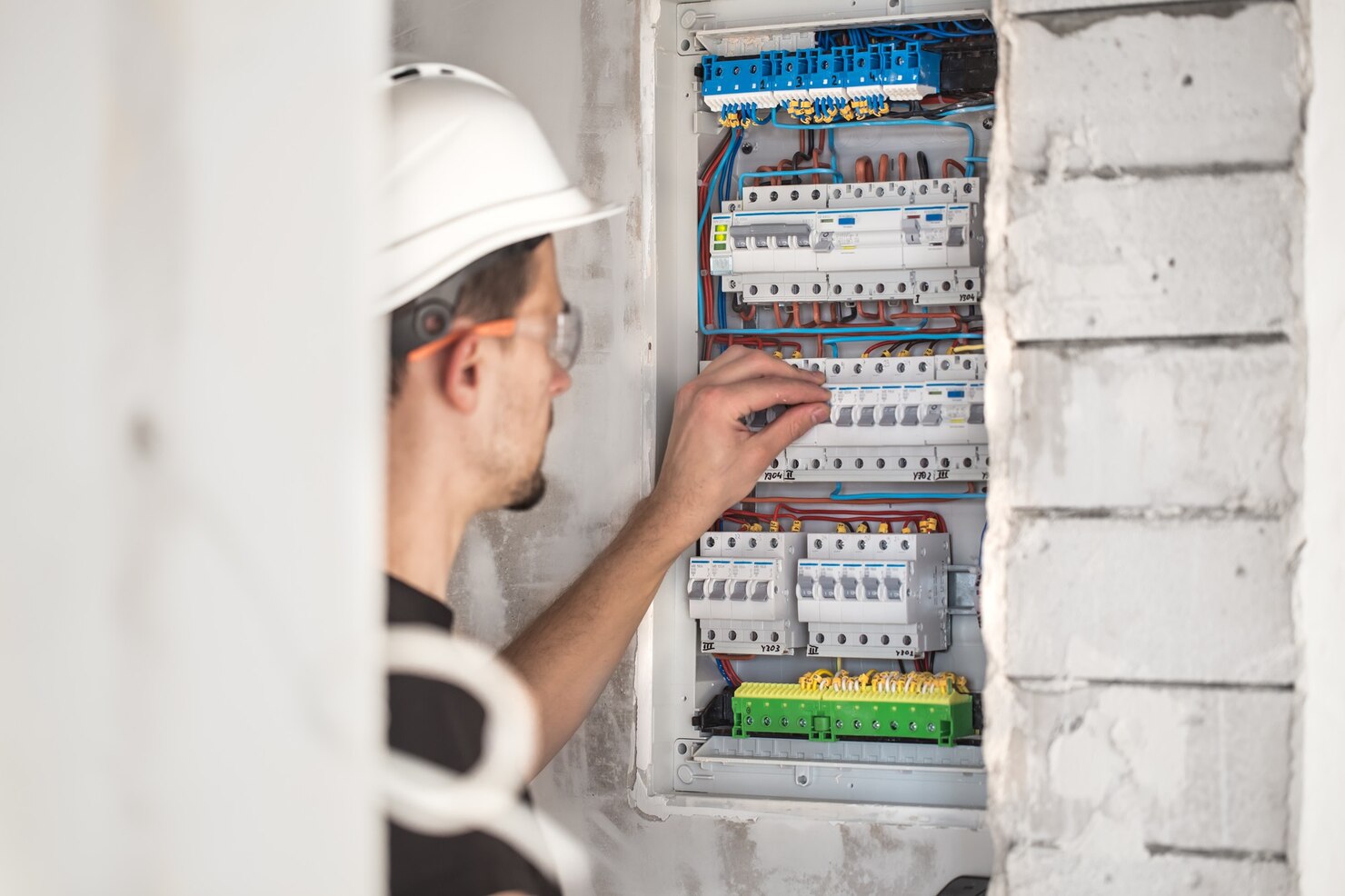 man-electrical-technician-working-switchboard-with-fuses-installation-connection-electrical-equipment_169016-5073 man-electrical-technician-working-switchboard-with-fuses-installation-connection-electrical-equipment_169016-5073